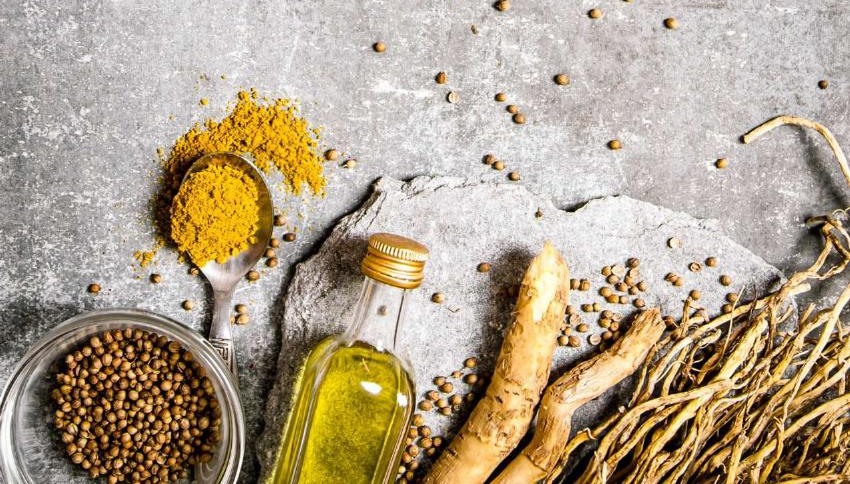 Golden oil, turmeric, coriander, and fresh roots