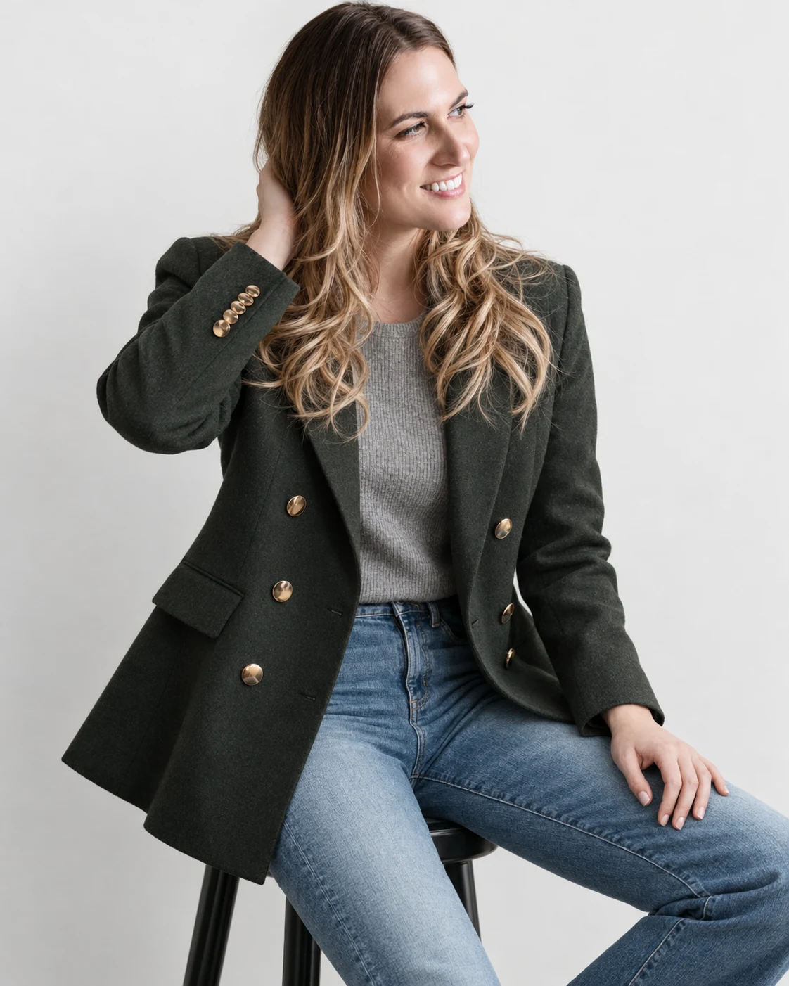 Dr. Michele Burklund in a green blazer, looking toward the accompanying text